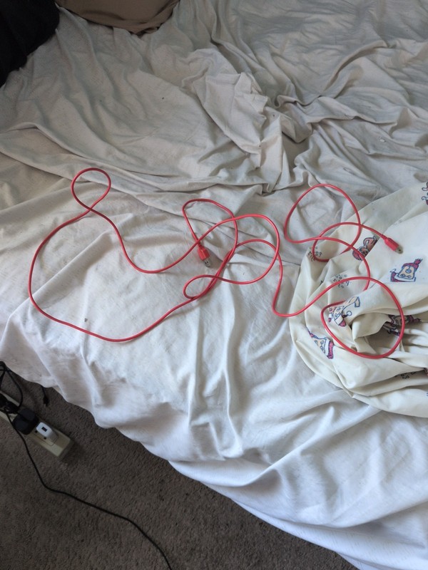 Bright orange USB data or charging cable with male USB-A/USB-C