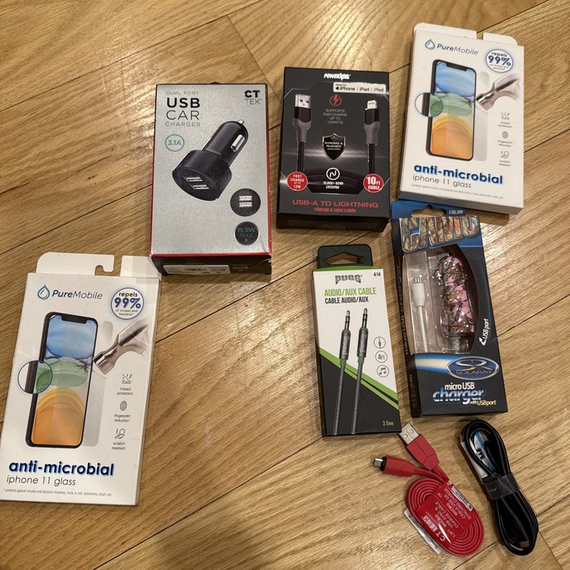 New phone accessory bundle with chargers, cables, and screen protectors