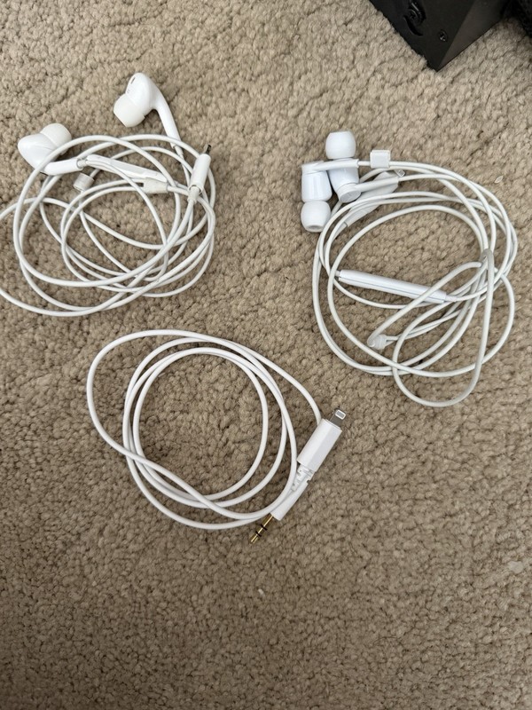 2 Sets Of Earbuds And A charger To Aux Cord Adapter
