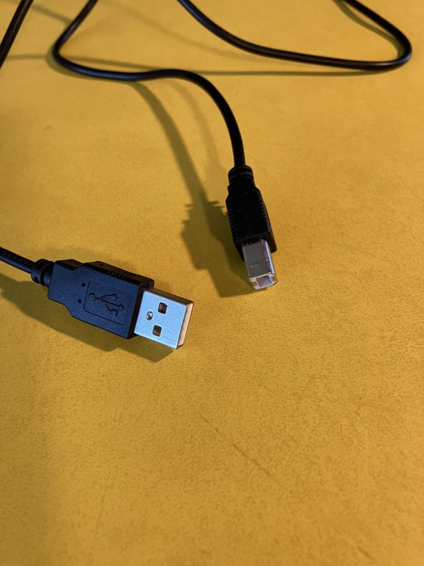 Lot of 3 unusual cords. Car charger cord, USB type B, unknown outlet power cord. gallery